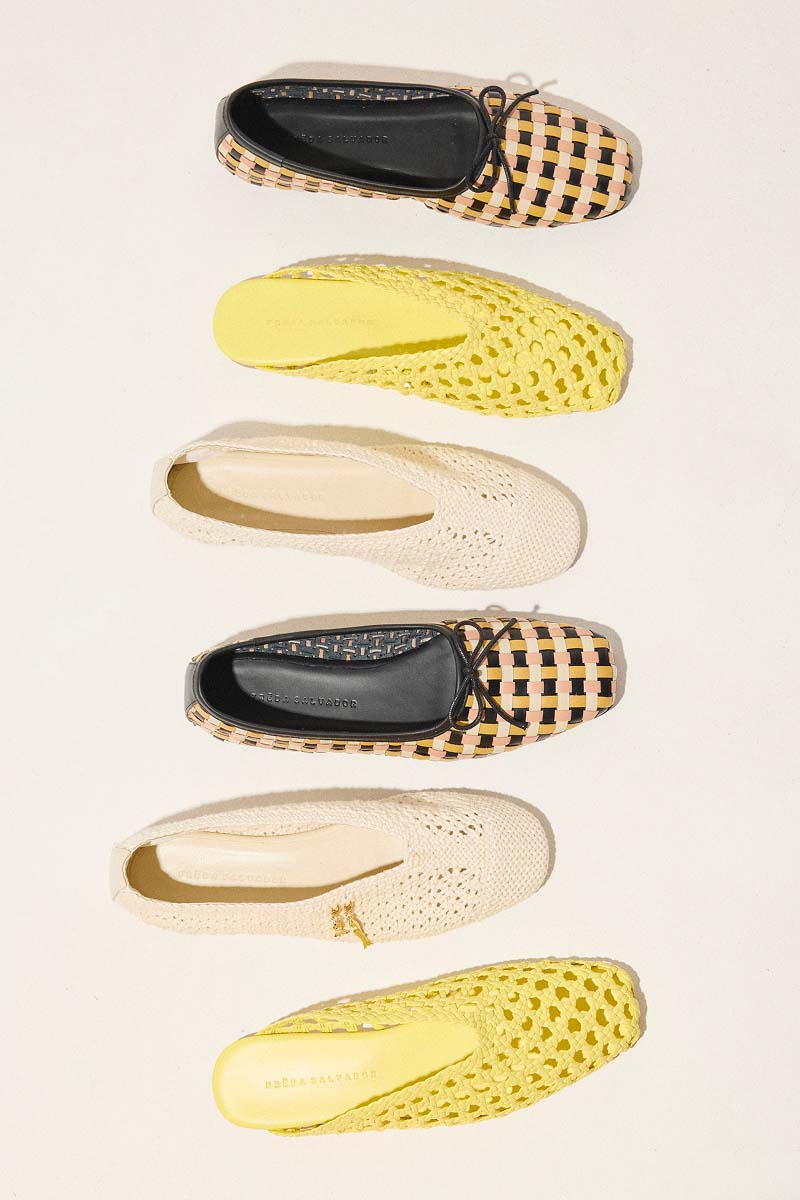 laydown of several styles on floor including JADA, ETTA, and DAISY flats