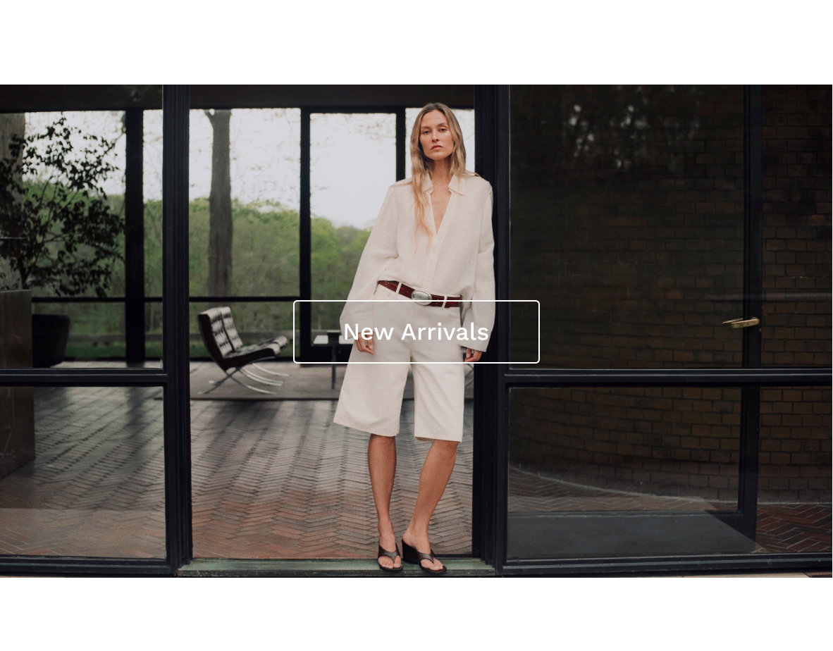 Image of a model in a white outfit with white text overlaid.