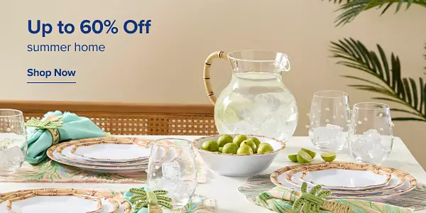 Up to 60% off summer home. Shop now. A set table with decretive dishware.