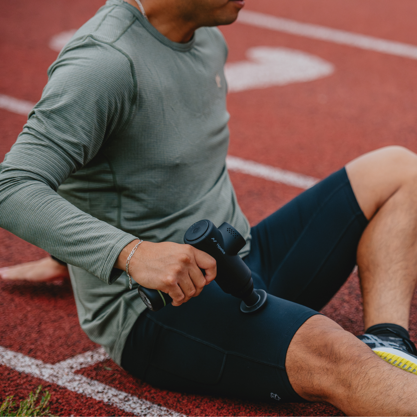 Runner using massage gun