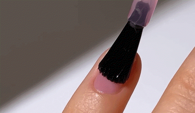 Sheer Strength Nail Blush being applied on nails