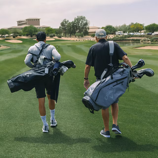 man and his father on a golf course