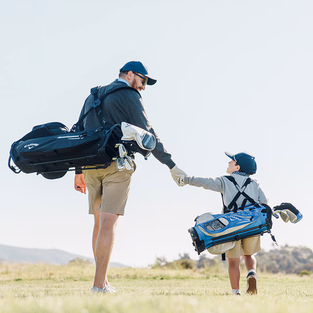 dad and son golfers on the course