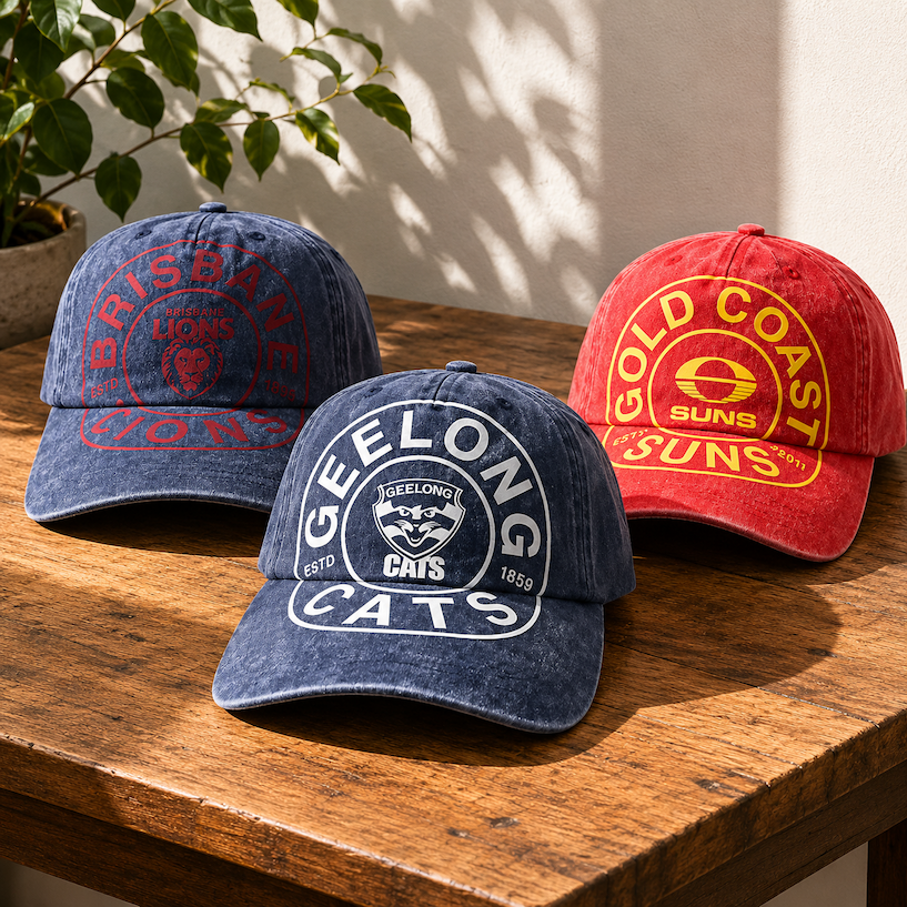 A range of AFL Caps Sitting On a Table