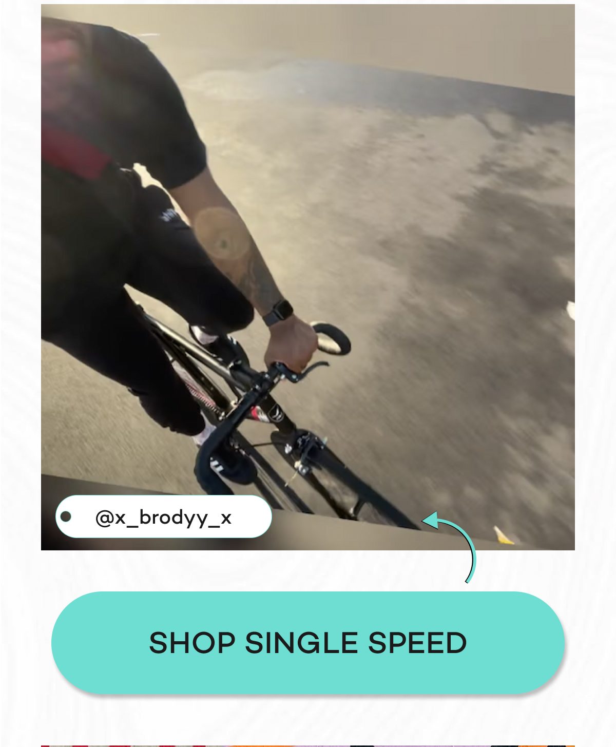 A cyclist riding a single-speed bike on a smooth surface.