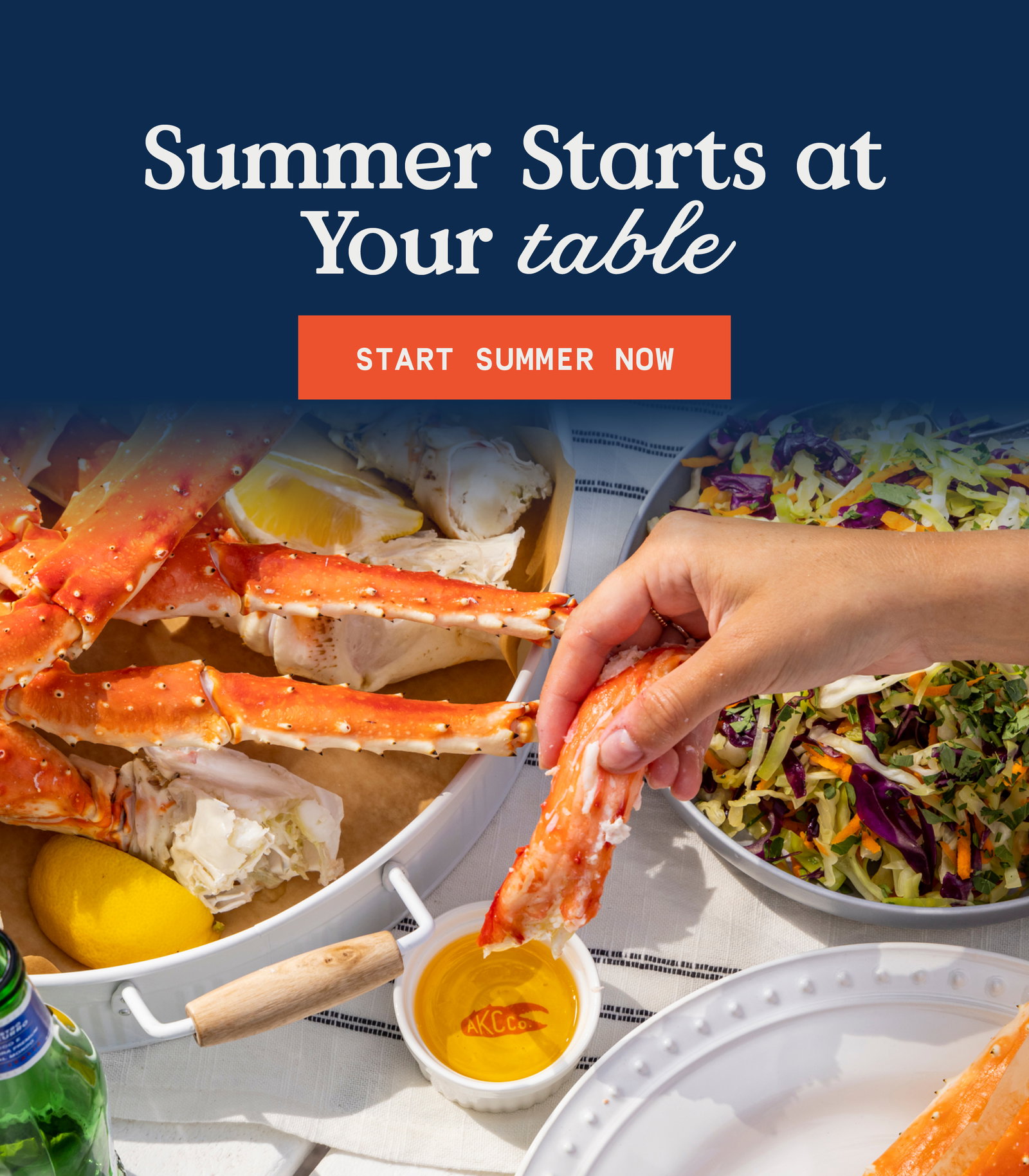 hand dipping king crab legs into butter ramekin. 