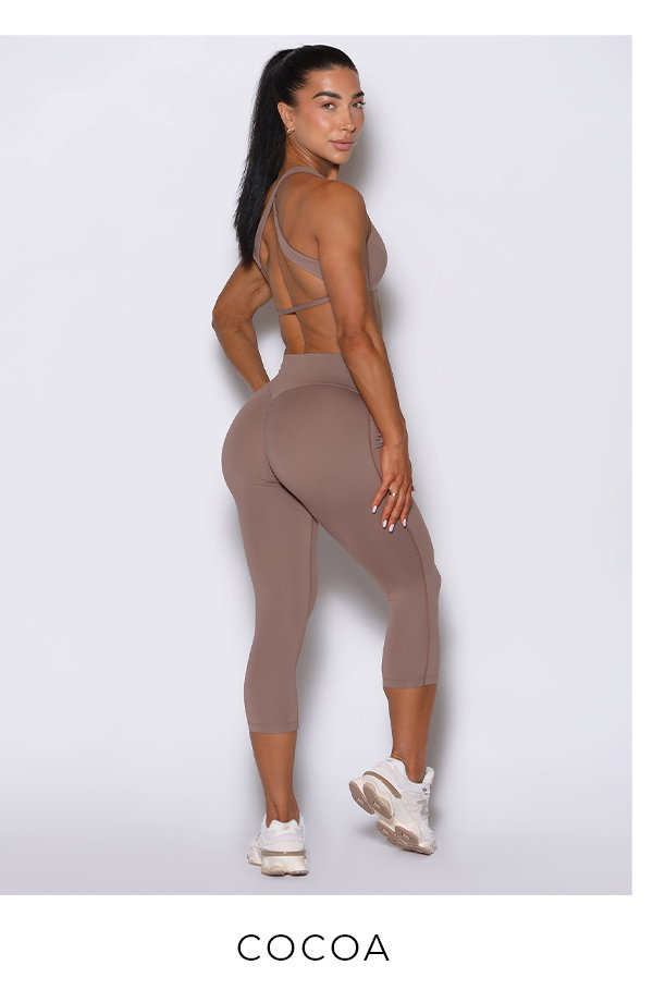 Model wearing Ace Sports Bra and Smooth Capri Leggings in Cocoa