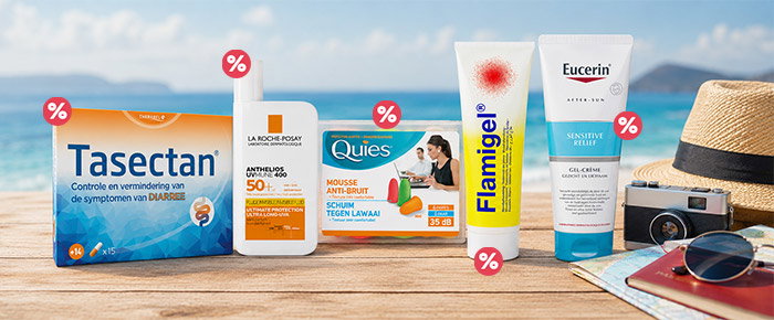 Beachside wooden table displaying Tasectan, La Roche‑Posay SPF50+, Quies earplugs, Flamigel and Eucerin tubes with sunglasses, camera, hat and sale tags