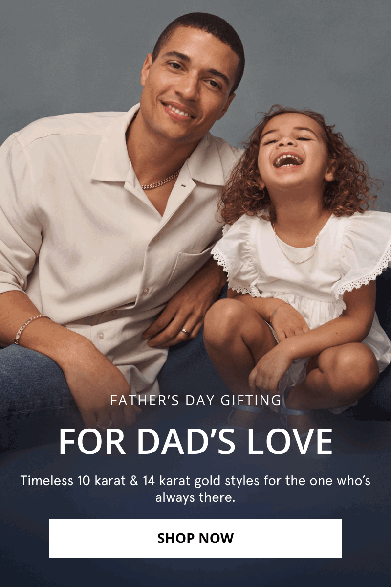 Father and daughter and laughing. Father is wearing a wedding band, a chain necklace and bracelet. Click shop now.