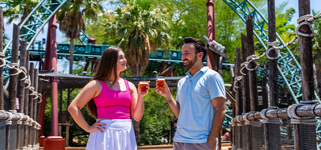 Two friends enjoying free beer samples at Busch Gardens