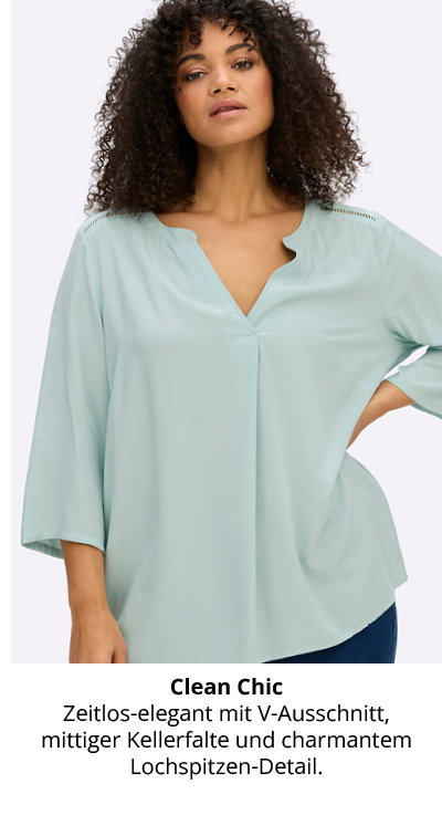 Model in pastellürkiser Tunika mit V-Ausschnitt und Lochspitze an den Schultern