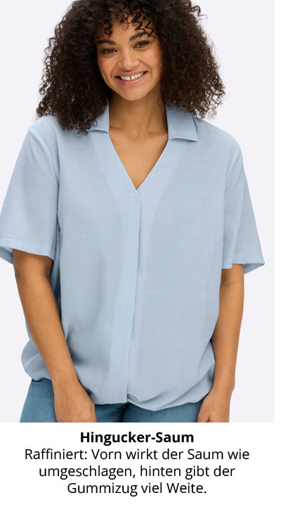 Model in hellblauer Tunika mit Polokragen und umgeschlagenem Saum vorn