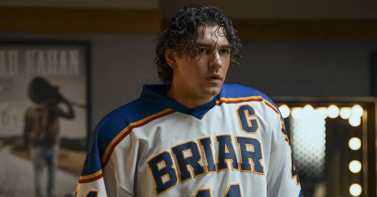 Person with dark, curly hair wearing a "Briar" hockey jersey