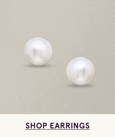 Classic pair of simple, circular pearl studs. Click here to shop earrings