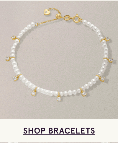 Delicate pearl strand bracelet accented with small gold-set diamond charms & gold clasp. Click here to shop bracelets