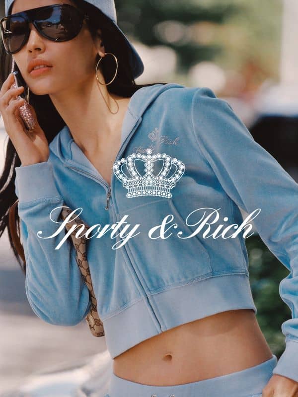 A medium shot shows a person wearing a light blue velour tracksuit and a baseball cap, holding a phone to their ear, with the text 'Sporty & Rich' and...