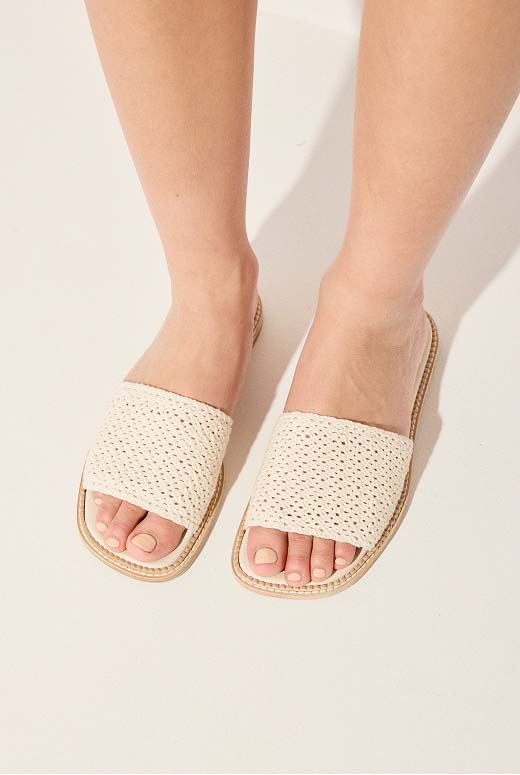 JUNO in Vanilla Crochet styled with a close-up view of bare legs.