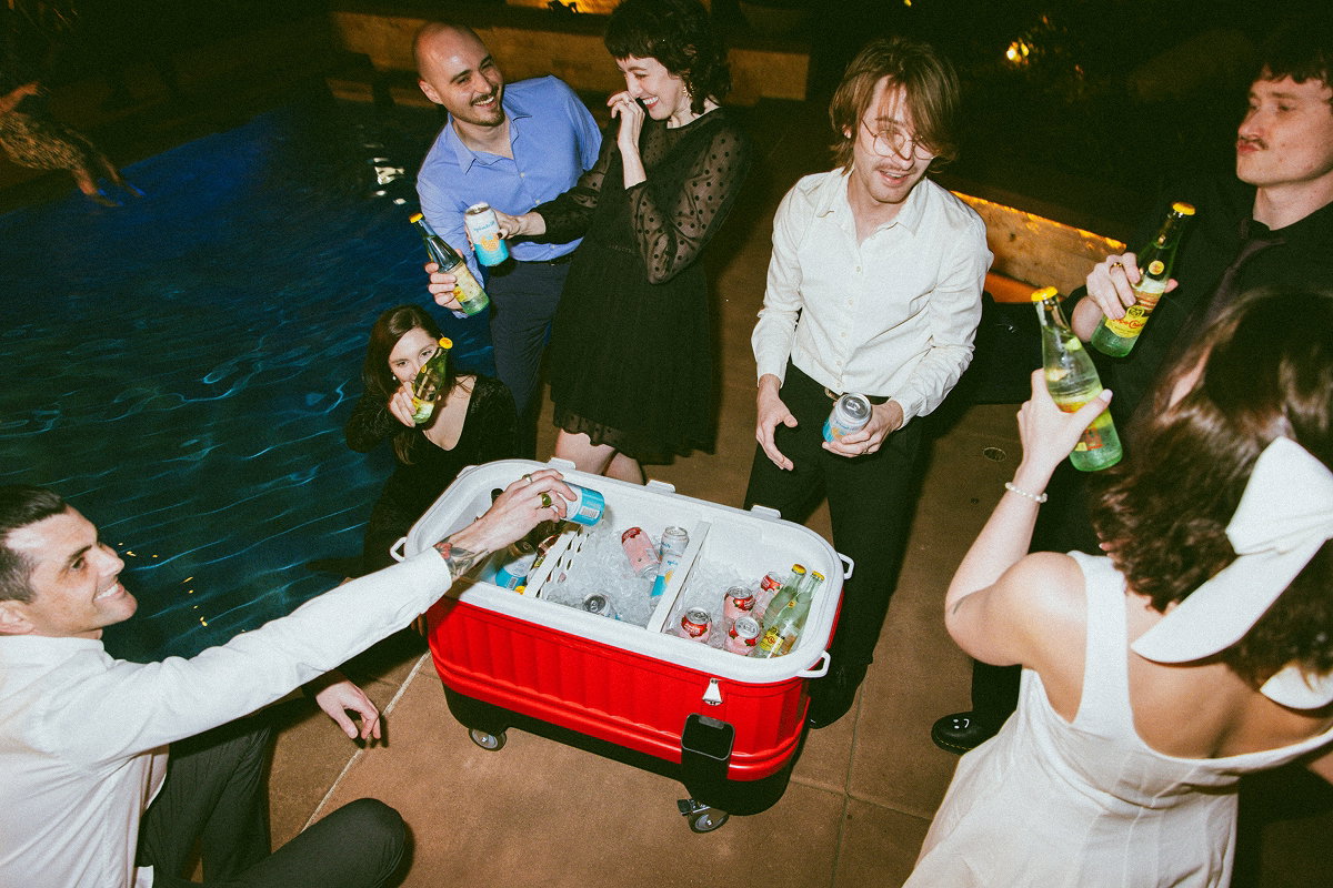 Image of people enjoying a party around their Igloo Party Bar Cooler