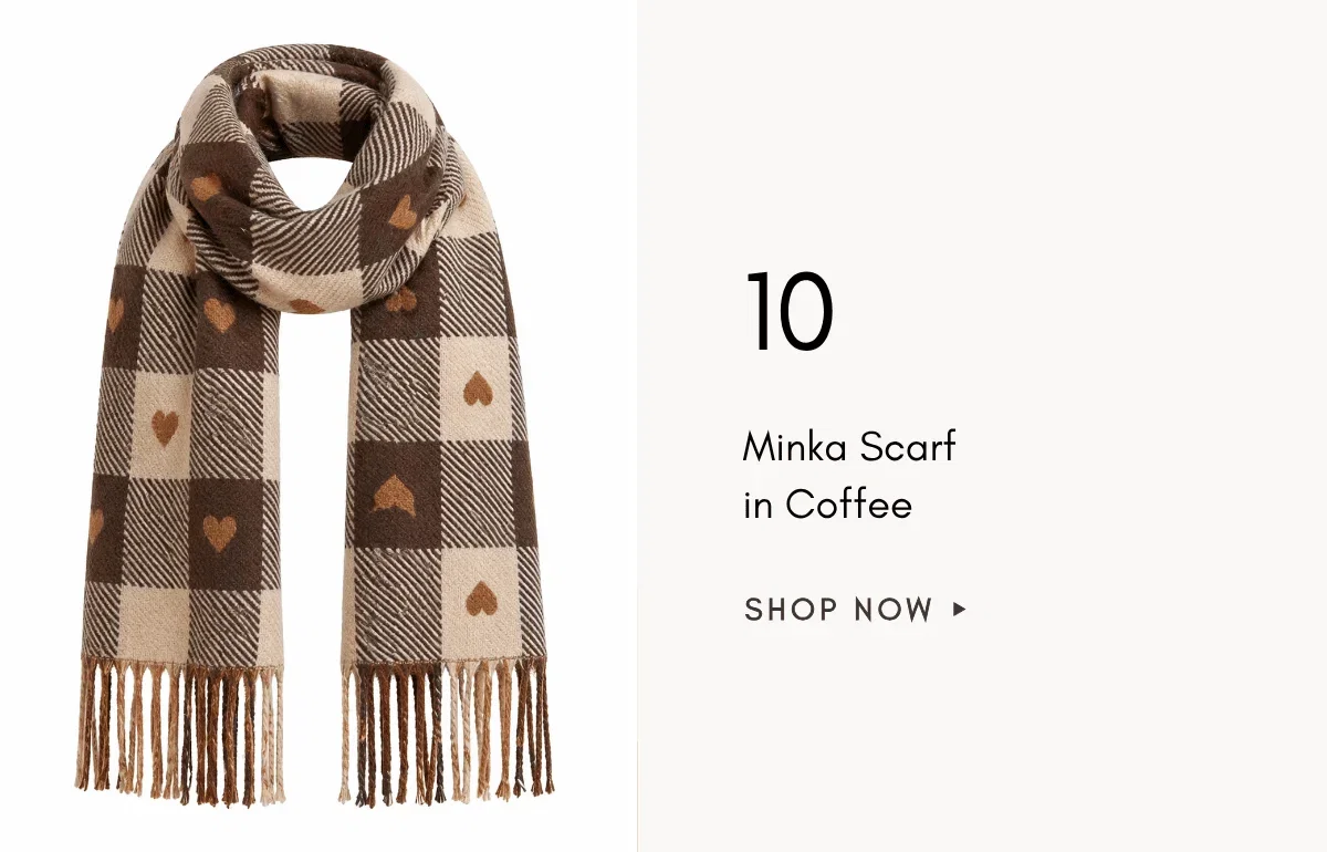 A medium shot displays a beige and brown checkered scarf with small brown hearts and fringed ends, positioned on the left side of the frame, while the...