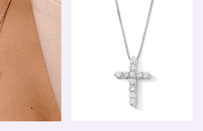 A white metal diamond cross pendant.