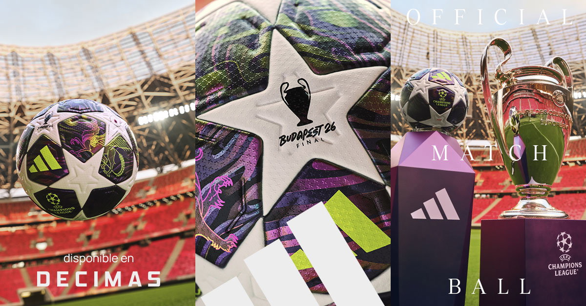 Official Adidas UEFA Champions League match ball with Budapest '26 final design beside Champions League trophy in stadium