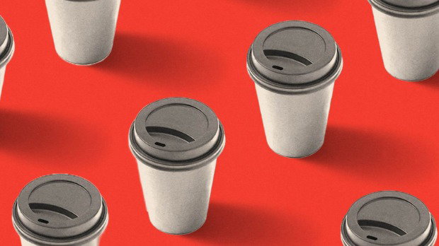 Black-and-white disposable coffee cups space out evenly from one another, set against a red background