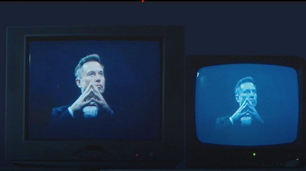 Two television sets side-by-side show an image of Elon Musk with his fingers steepled