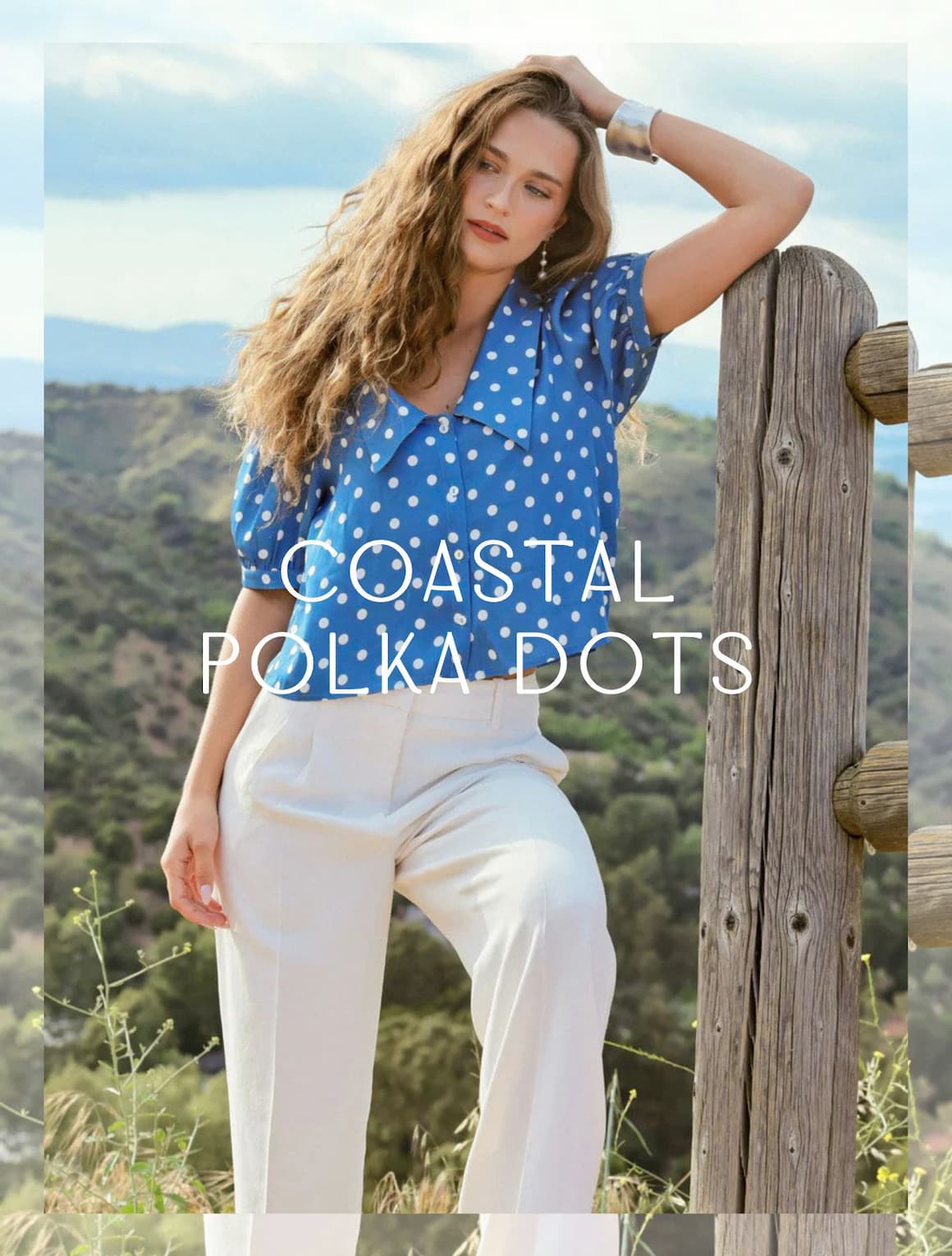 A lady wearing a polka dot cropped silk blouse.
