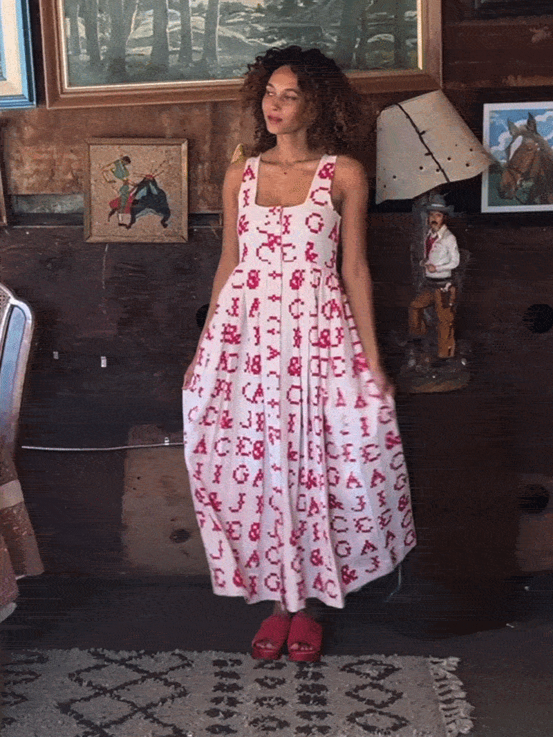 model in monogram dress
