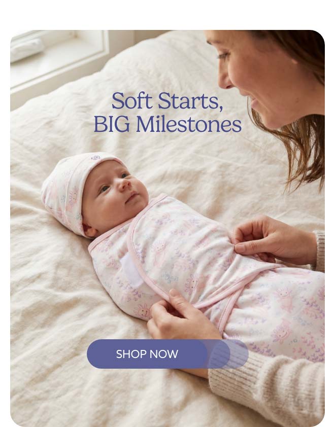 A baby in the Warmies Pink Axolotl Swaddle & Beanie set. Shop Now.