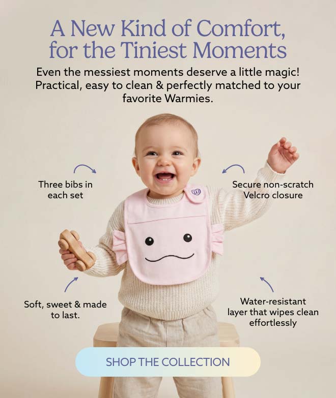 A baby wearing a Pink Axolotl Bib. Shop Warmies Baby & Toddler Collection.