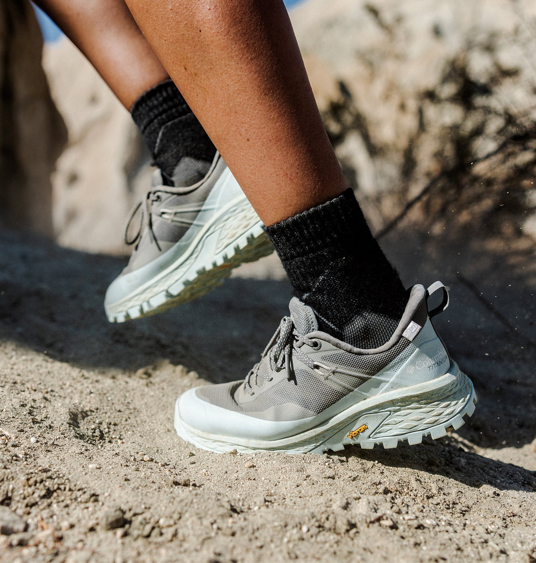 A woman on a gravel path with her Tellurix Titanium OutDry Shoe