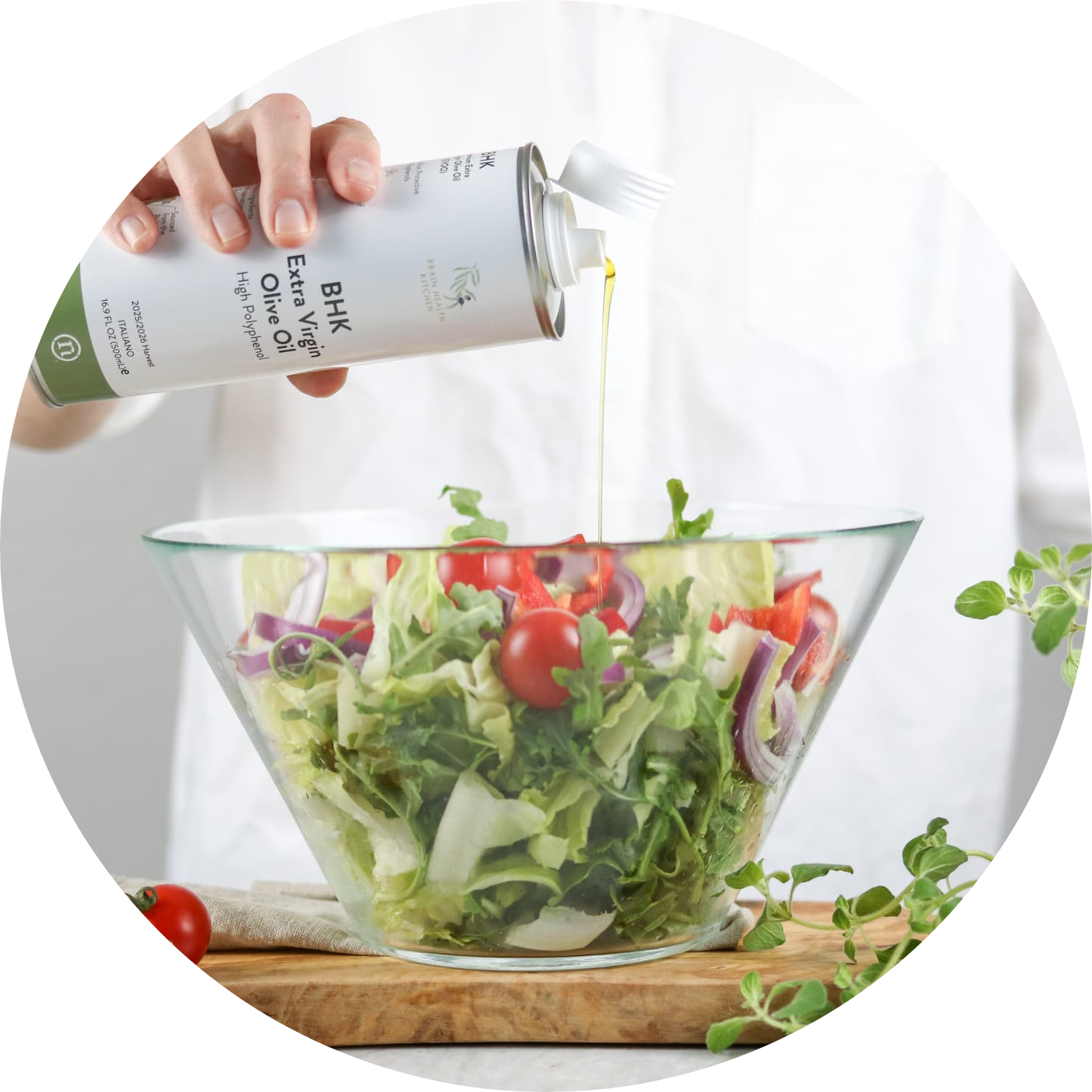 Brain Health Kitchen Extra Virgin Olive Oil (BHK EVOO) poured over a salad