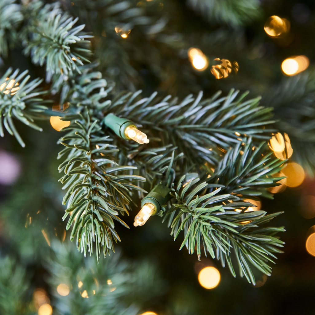 Christmas tree branch with pre-lit bulbs