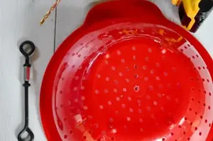 Drill a hole through a collander for an outdoor hack birdwatchers are going to LOVE