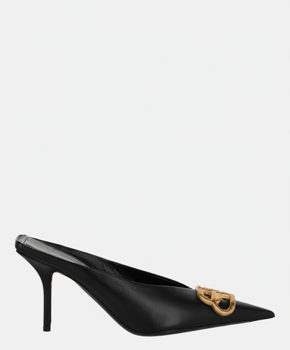Black leather mule with a pointed toe and gold buckle detail.