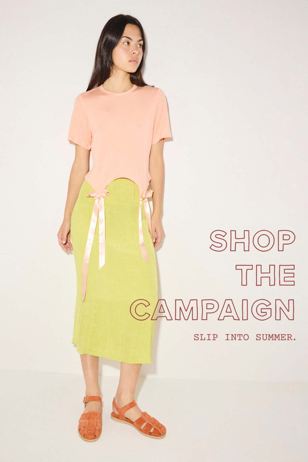 SERA in Cantaloupe Suede styled with a peach t-shirt and a lime green midi skirt.
