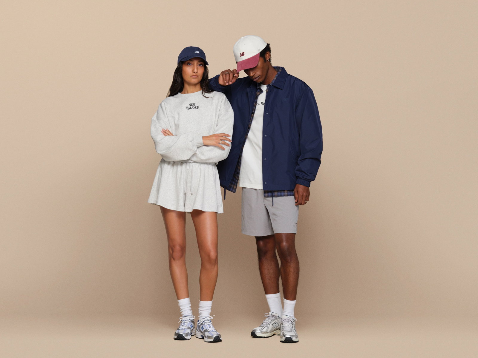 Man and women pictured in head-to-toe New Balance shoes and apparel