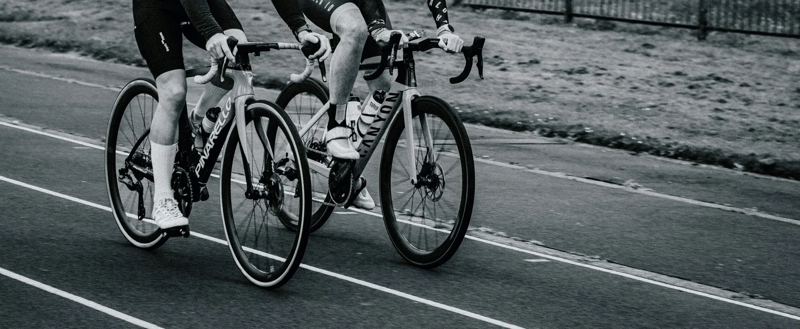 Cropped riders on bike