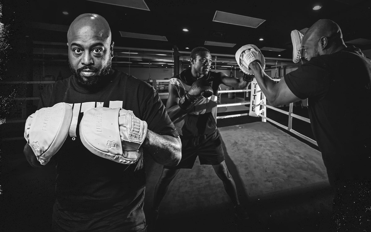 LIFESTYLE IMAGE SHOWING TITLE WHITE PUNCH MITTS 2.0