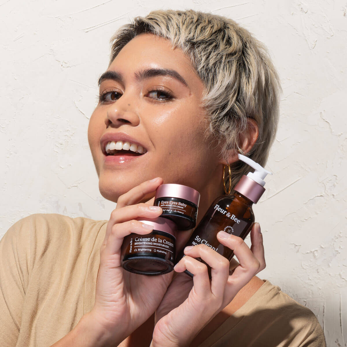 woman holding skincare products