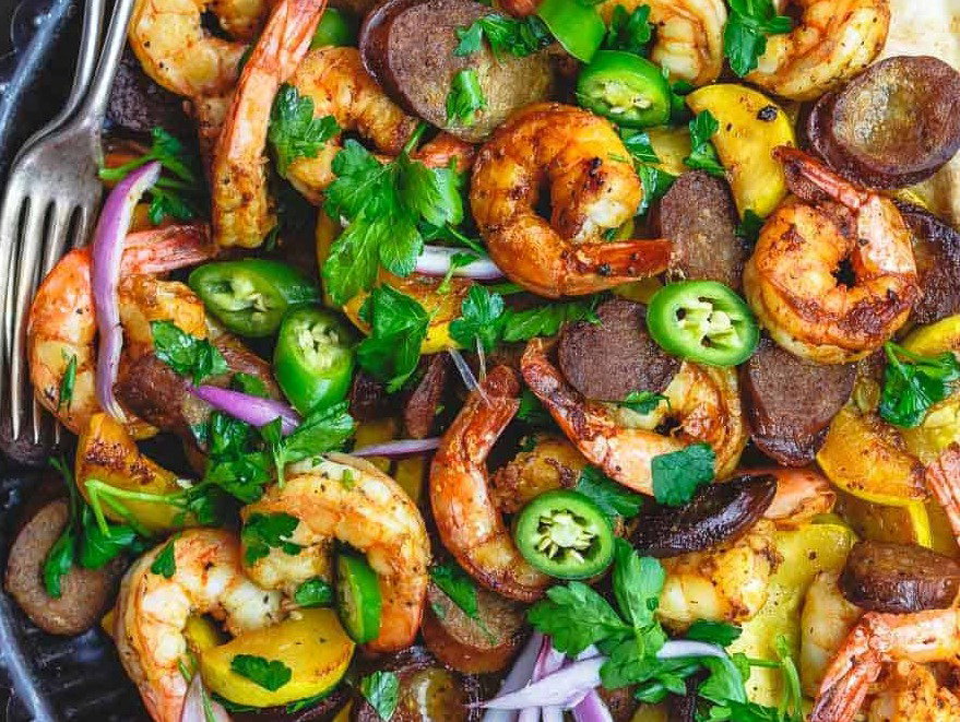 Shrimp with Chorizo and Squash in a skillet.