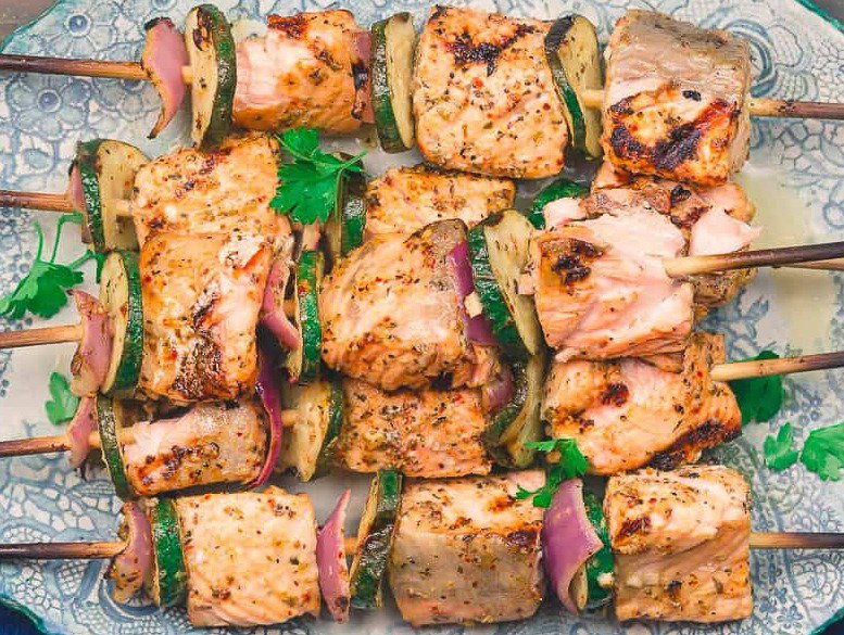 Salmon Kabobs on a platter.
