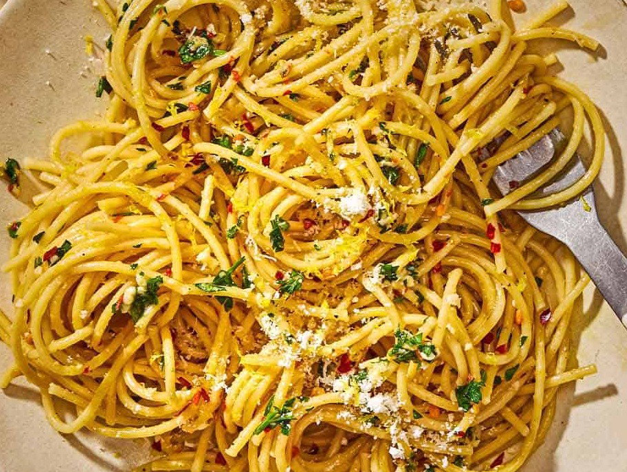 Lemon pasta on a plate with a fork.