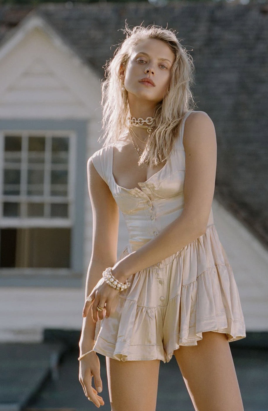 an image of a woman in a dress is posing for a picture