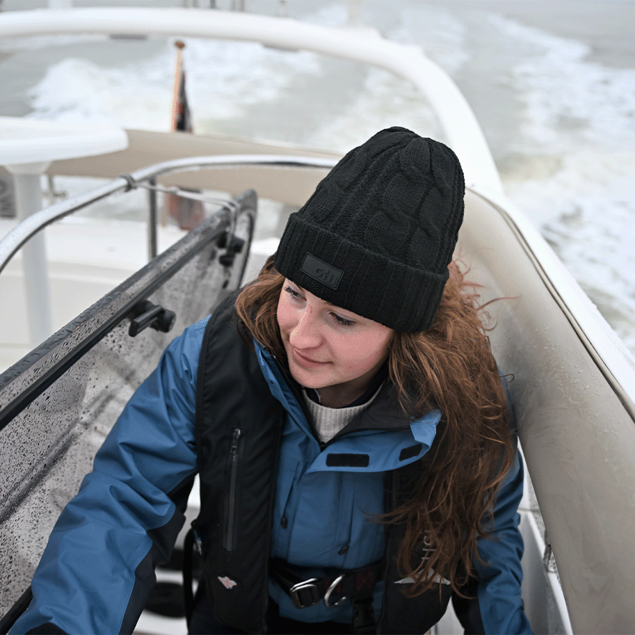 Woman on a boat a Storm Blue Aspect 2.0 Jacket