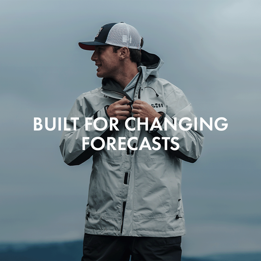 Man zipping up a Glacier Aspect 2.0 Jacket