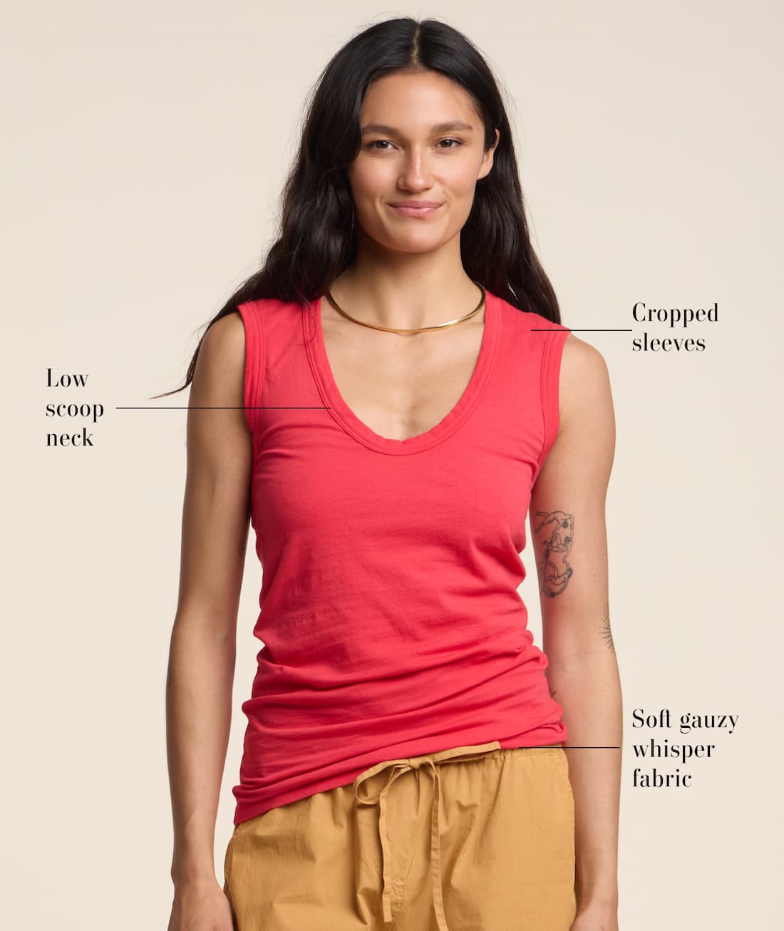 Model wearing Estina Tank Top in Rio. Text reads: Low scoop neck, cropped sleeves, and soft gauzy whisper fabric. 