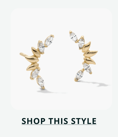 Pair of gold marquise-cut diamond ear climbers. Click here to shop this style