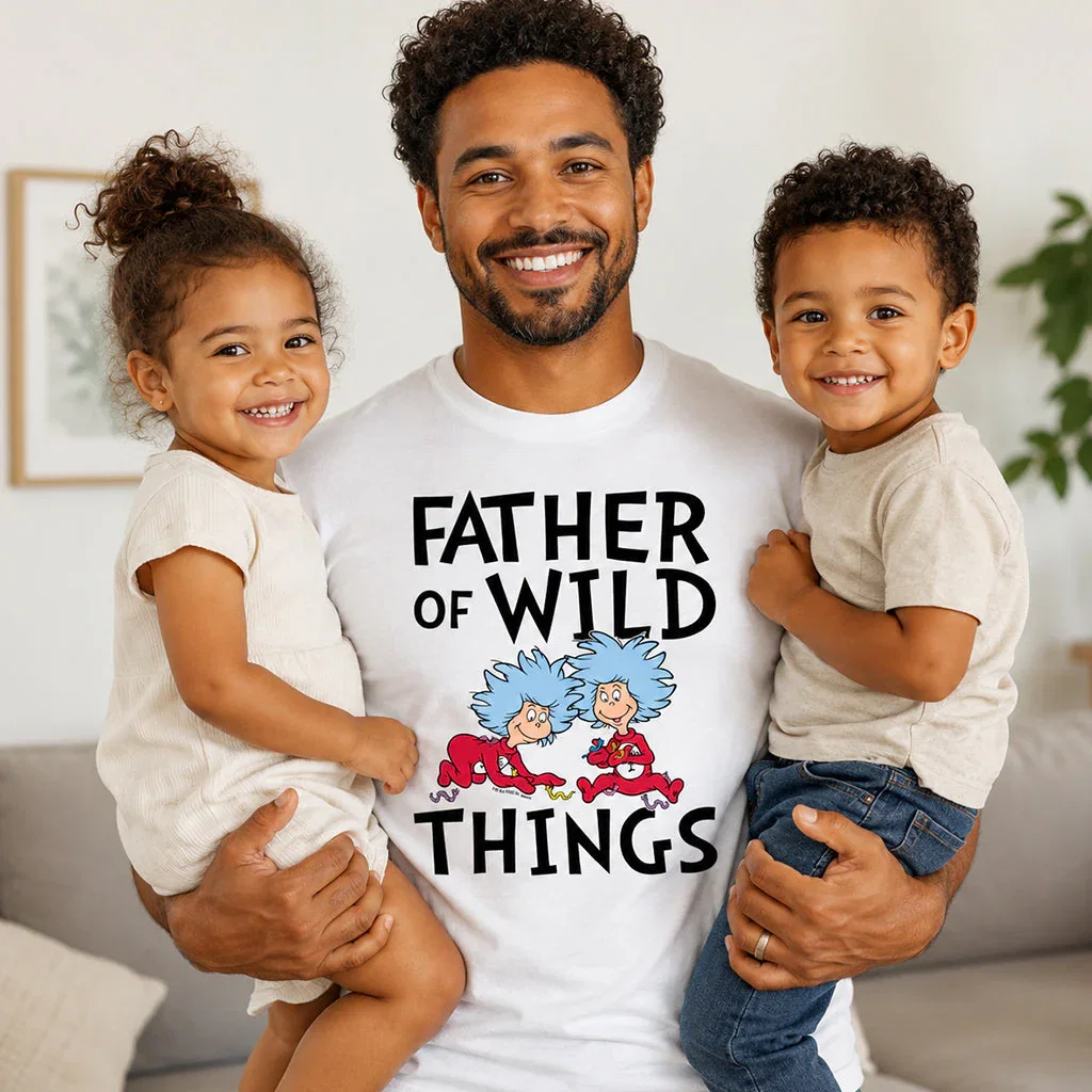 Man holding two young children wearing 